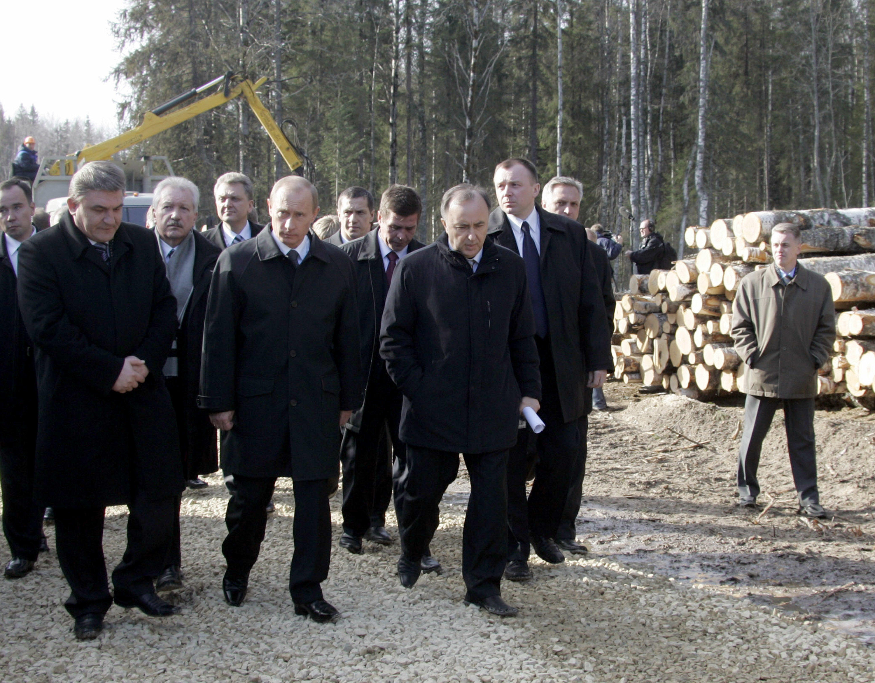 Russian President Vladimir Putin (C) visits a timber plant in Syktyvkar of Russian Komi Republic (900 miles East from Moscow), April 6, 2006. Putin is on a working trip to look into the current conditions of the local timber industry and the prospects for