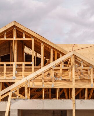 More than 30% of lumber used in US low-rise housing construction comes from Canada - with Trump's plans to put a 52% indirect tax on imports (between tariffs and duties) having a major impact on the building and construction industry. (Photo Credit: 2059912031 via Shutterstock Images)