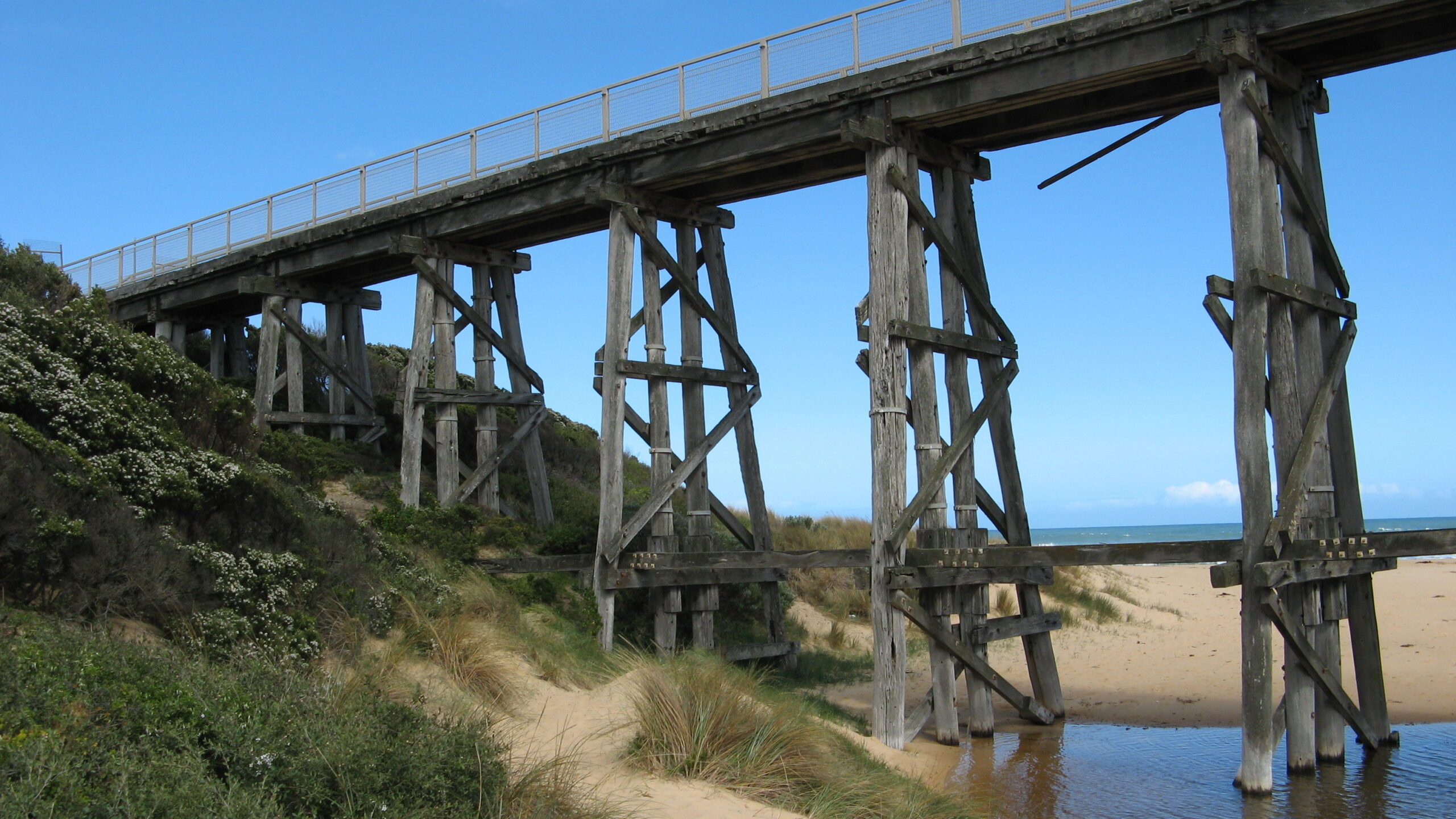 This trestle bridge near Kilcunda, Victoria, Australia is one of thousands of long-span hardwood timber bridges located Australia-wide. (Photo Credit: 1398939950 via Shutterstock Images)
